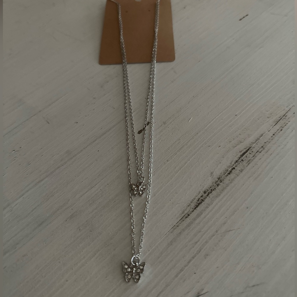 NWT Silvertone multi chain butterfly necklace